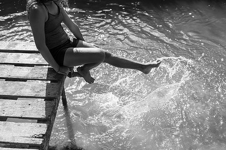 simsearch:6113-06498718,k - Playful girl splashing feet in sunny river Stock Photo - Premium Royalty-Free, Code: 6113-09240065