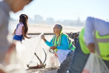 Senior woman and girl volunteer cleaning up litter on sunny beach Stock Photo - Premium Royalty-Free, Code: 6113-09240178