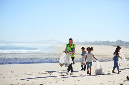 family cleaning - Children volunteers cleaning up beach litter Stock Photo - Premium Royalty-Free, Code: 6113-09240201