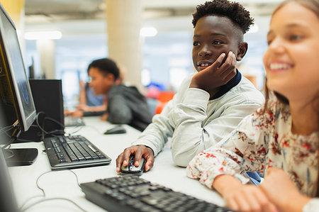 simsearch:6113-08655413,k - Junior high students using computer in computer lab Stock Photo - Premium Royalty-Free, Code: 6113-09240335