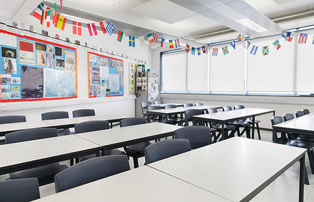 school flag - International flags hanging over desks in classroom Stock Photo - Premium Royalty-Free, Code: 6113-09240407