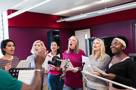 simsearch:6113-09168289,k - Womens choir with sheet music singing in music recording studio Stock Photo - Premium Royalty-Free, Code: 6113-09240879