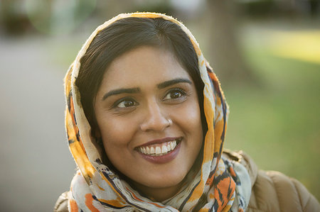 Portrait smiling, happy Muslim woman wearing hijab Stock Photo - Premium Royalty-Free, Code: 6113-09240956