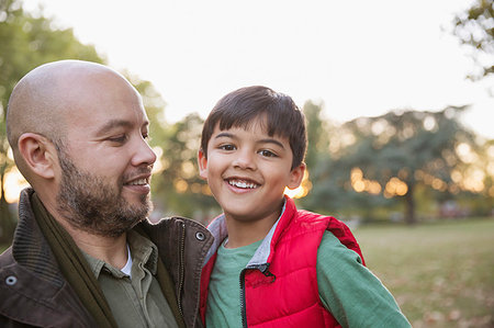 simsearch:649-06432444,k - Portrait happy father and son in autumn park Stock Photo - Premium Royalty-Free, Code: 6113-09240979