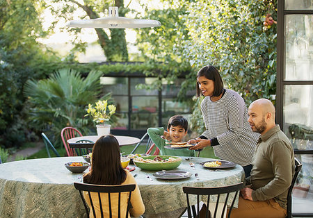 simsearch:6113-08909960,k - Family eating lunch at dining table Stock Photo - Premium Royalty-Free, Code: 6113-09241033