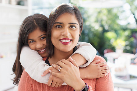 simsearch:6113-09199972,k - Portrait happy, affectionate mother and daughter hugging Foto de stock - Royalty Free Premium, Número: 6113-09241126