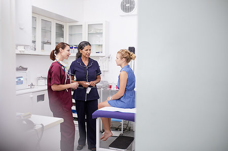 examination - Female doctor and nurse talking to girl patient in clinic examination room Stock Photo - Premium Royalty-Free, Code: 6113-09241530