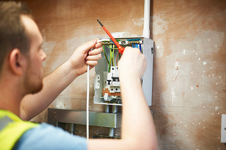 simsearch:6113-06721341,k - Male electrician student practicing in workshop Stock Photo - Premium Royalty-Free, Code: 6113-09272677