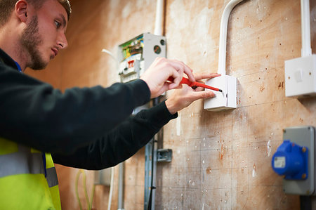 Male electrician student practicing in workshop Stock Photo - Premium Royalty-Free, Code: 6113-09272680