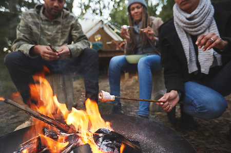 simsearch:625-01251856,k - Family roasting marshmallows at campsite campfire Stock Photo - Premium Royalty-Free, Code: 6113-09272755