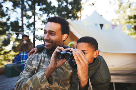simsearch:628-00920051,k - Curious father and son with binoculars at campsite Stock Photo - Premium Royalty-Free, Code: 6113-09272758