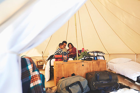 simsearch:6113-06909381,k - Family relaxing on bed inside camping yurt Stock Photo - Premium Royalty-Free, Code: 6113-09272821