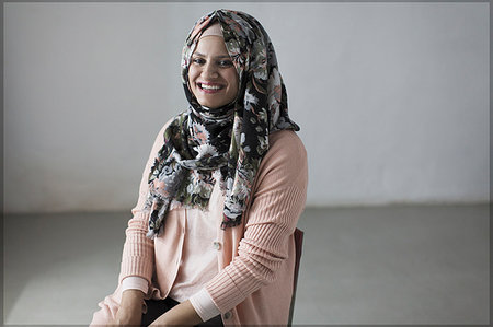 Portrait smiling, confident woman in floral hijab Stock Photo - Premium Royalty-Free, Code: 6113-09200096