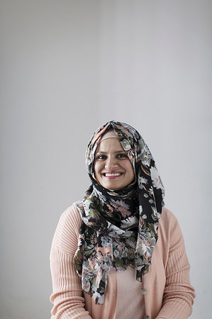 Portrait smiling, confident woman wearing floral hijab Stock Photo - Premium Royalty-Free, Code: 6113-09200008