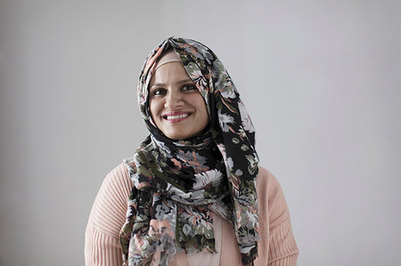 Portrait smiling, confident woman wearing floral hijab Stock Photo - Premium Royalty-Free, Code: 6113-09200016