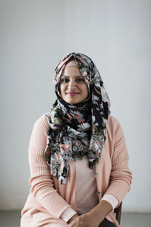 Portrait smiling, confident woman wearing floral hijab Stock Photo - Premium Royalty-Free, Code: 6113-09200025