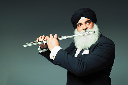 simsearch:6113-09200061,k - Well-dressed senior man in turban playing flute Foto de stock - Sin royalties Premium, Código: 6113-09200103