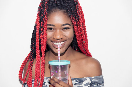 simsearch:6113-09220464,k - Portrait smiling, confident teenage girl drinking smoothie Foto de stock - Sin royalties Premium, Código: 6113-09220483