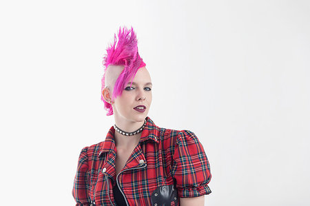 Portrait confident young woman with pink mohawk Stock Photo - Premium Royalty-Free, Code: 6113-09220484