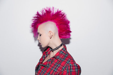 Portrait confident young woman with pink mohawk Stock Photo - Premium Royalty-Free, Code: 6113-09220489