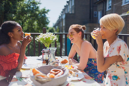 people and balcony and apartment - Young women friends enjoying brunch on sunny apartment balcony Stock Photo - Premium Royalty-Free, Code: 6113-09220668