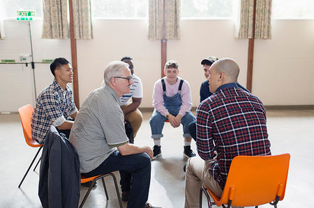 simsearch:6113-09220733,k - Men talking in group therapy circle Stock Photo - Premium Royalty-Free, Code: 6113-09220741