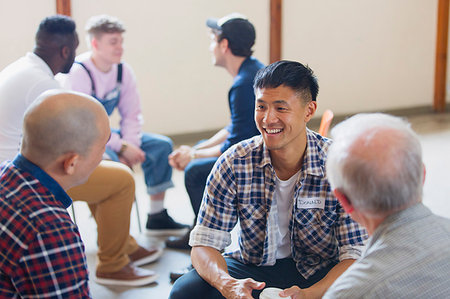 Men talking and listening in group therapy Stock Photo - Premium Royalty-Free, Code: 6113-09220788