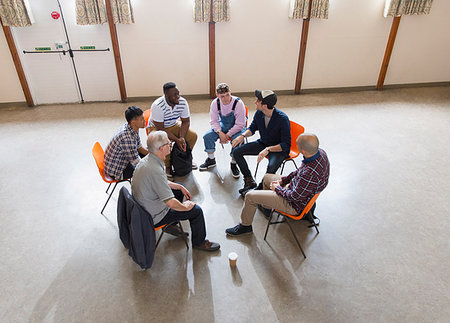 simsearch:6113-09220733,k - Men talking in group therapy circle Stock Photo - Premium Royalty-Free, Code: 6113-09220716