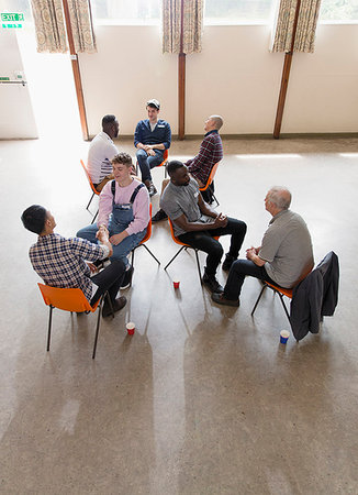 Men talking in group therapy Stock Photo - Premium Royalty-Free, Code: 6113-09220727