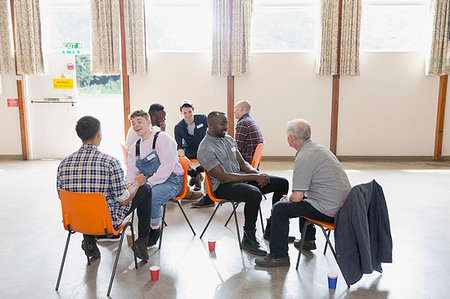 simsearch:6113-09220733,k - Men talking in group therapy in community center Stock Photo - Premium Royalty-Free, Code: 6113-09220726