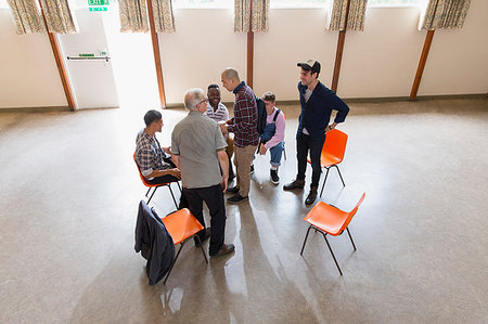 Men talking in group therapy Stock Photo - Premium Royalty-Free, Code: 6113-09220732