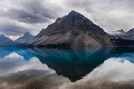 Tranquil view of craggy mountains and placid Bow Lake, Alberta, Canada Stock Photo - Premium Royalty-Free, Code: 6113-09239851