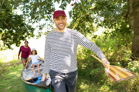 simsearch:6113-09240050,k - Family carrying canoe in woods Stock Photo - Premium Royalty-Free, Code: 6113-09239863