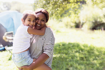 simsearch:6124-08945893,k - Portrait affectionate mother holding daughter at sunny campsite Stock Photo - Premium Royalty-Free, Code: 6113-09239963
