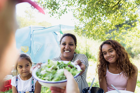 simsearch:6113-09240013,k - Happy family enjoying salad lunch at campsite Stock Photo - Premium Royalty-Free, Code: 6113-09239991