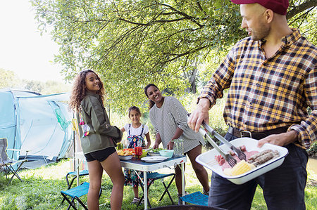 simsearch:6113-08393725,k - Family barbecuing, preparing lunch at campsite Stock Photo - Premium Royalty-Free, Code: 6113-09239998