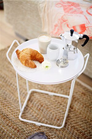 Croissant And Cup Of Coffee On Table Foto de stock - Sin royalties Premium, Código: 6115-06778503
