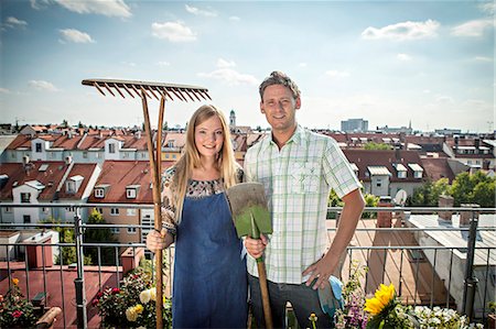 roof terrace - Couple On Balcony, Holding Garden Tools, Munich, Bavaria, Germany, Europe Stock Photo - Premium Royalty-Free, Code: 6115-06778646