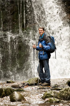 Man Standing In Front Of A Waterfall, Bavaria, Germany, Europe Photographie de stock - Premium Libres de Droits, Code: 6115-06778799