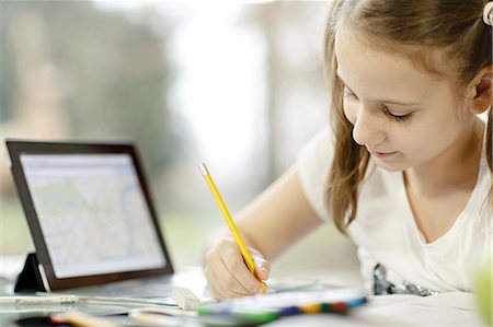 elearning - Girl using digital tablet and doing homework, Osijek, Croatia, Europe Stock Photo - Premium Royalty-Free, Code: 6115-06779066