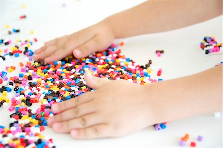 photograph chaotic table - Girl Playing With Ironing Beads Stock Photo - Premium Royalty-Free, Code: 6115-06732784