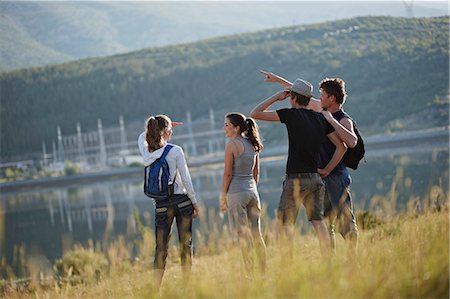 simsearch:6115-06732877,k - Croatia, Young people looking across storage lake Stock Photo - Premium Royalty-Free, Code: 6115-06732846