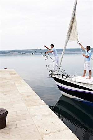 dock side view - Croatia, Sailboat entering port, docking maneuver Stock Photo - Premium Royalty-Free, Code: 6115-06732865