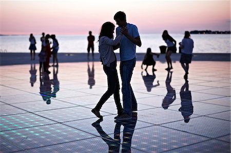 Croatia, Dalmatia, Solar panels as a dance floor, sunset in background Foto de stock - Sin royalties Premium, Código: 6115-06732877