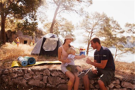 simsearch:6115-06732814,k - Croatia, Dalmatia, Family with one children on camping site Stock Photo - Premium Royalty-Free, Code: 6115-06732820