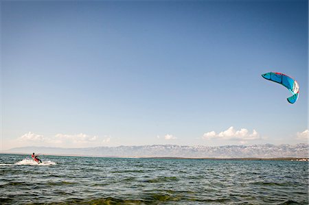 Croatia, Man kite surfing at high speed Photographie de stock - Premium Libres de Droits, Code: 6115-06732958