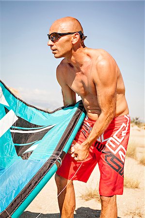 Croatia, Man with kite on beach Stock Photo - Premium Royalty-Free, Code: 6115-06732959