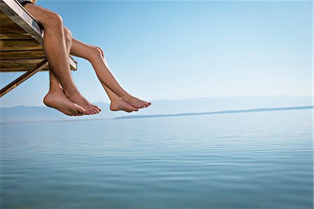 foot (human) - Croatia, Young couple relaxes on jetty, by the sea Stock Photo - Premium Royalty-Free, Code: 6115-06732976