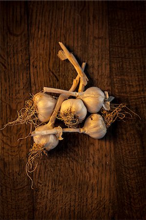 Fresh Garlic On Wooden Table, Croatia, Slavonia, Europe Stock Photo - Premium Royalty-Free, Code: 6115-06732936