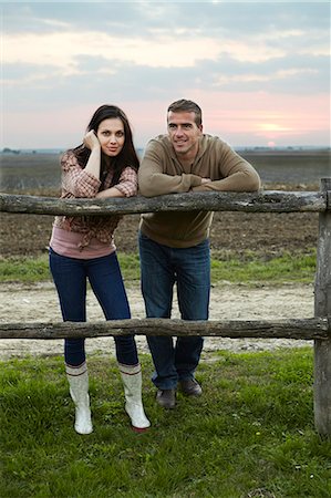 dusk couple - Young Couple Leaning On Wooden Fence, Baranja, Croatia, Europe Stock Photo - Premium Royalty-Free, Code: 6115-06733063